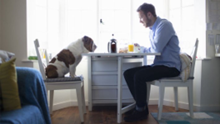 A man sitting in his apartment.