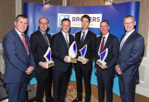 A photograph of the Zurich team picking up their awards