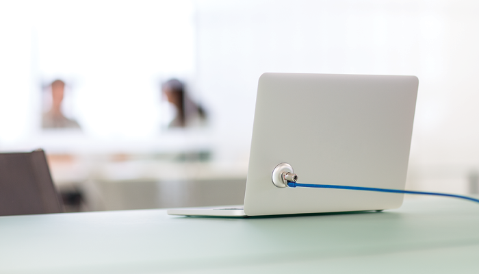 a white laptop with a blue wire