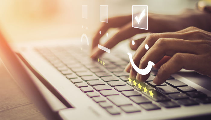 hands typing on a computer
