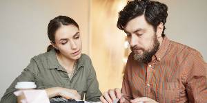 couple at home doing accounts