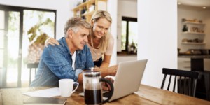 older couple at home on laptop
