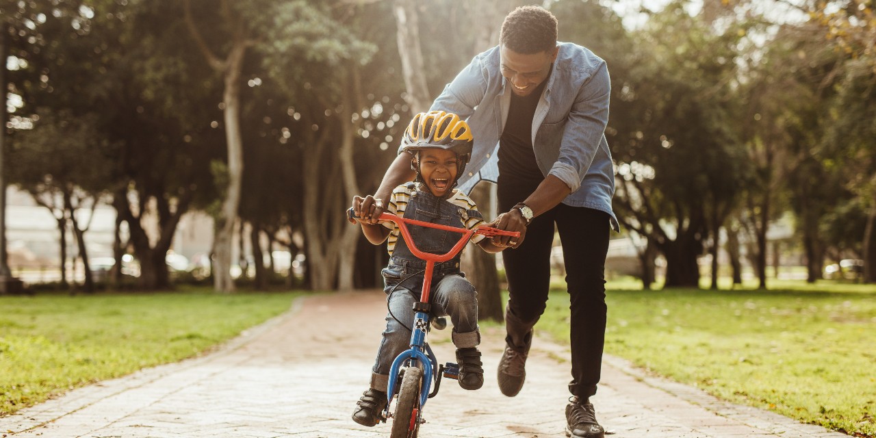 father and son on bike