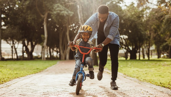 father and son on bike