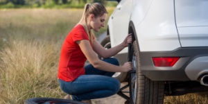 woman changing tyre