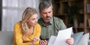 couple at home doing paperwork