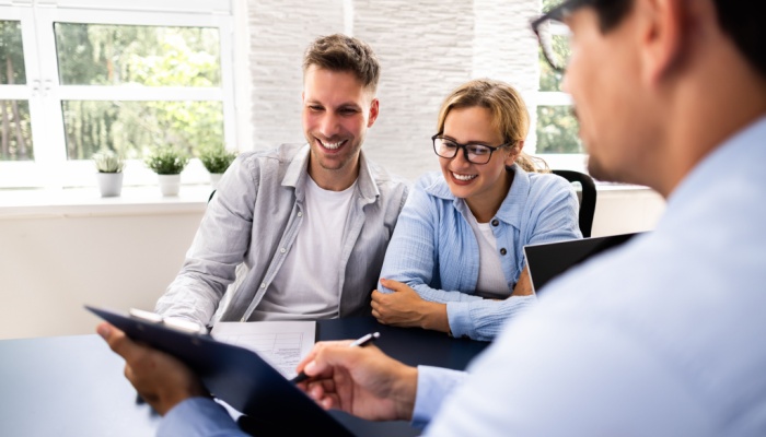 financial advisor with young couple