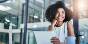 young woman in office on tablet