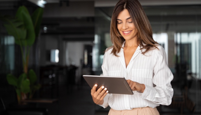 woman standing with tablet