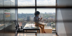 young woman in office on phone