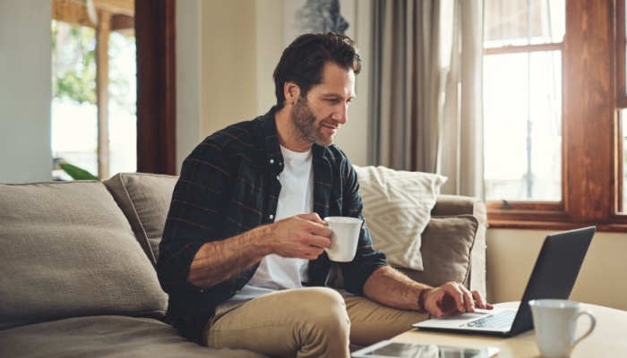 man at home having coffee