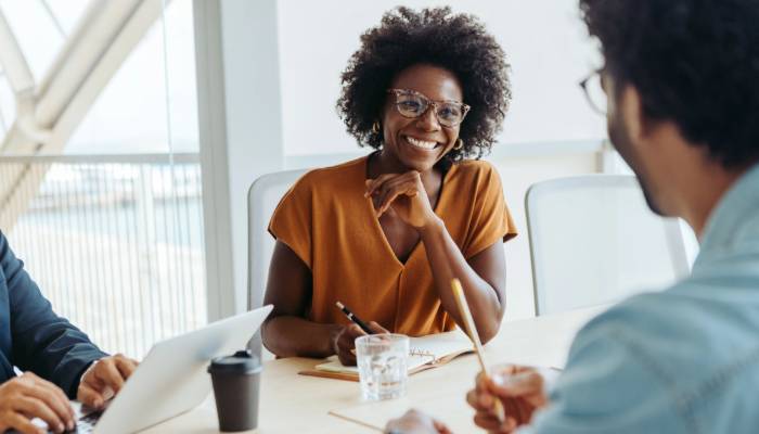 female hosting meeting in office