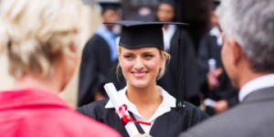 college student graduating with her parents