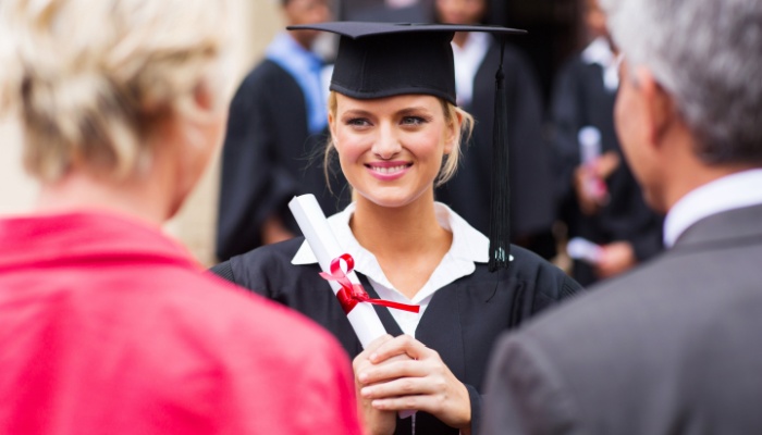 college student graduating with her parents