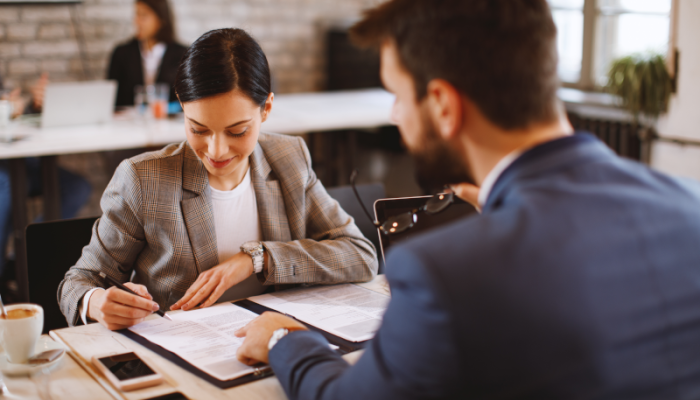 Male financial advisor giving woman advice