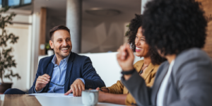 three office workers laughing