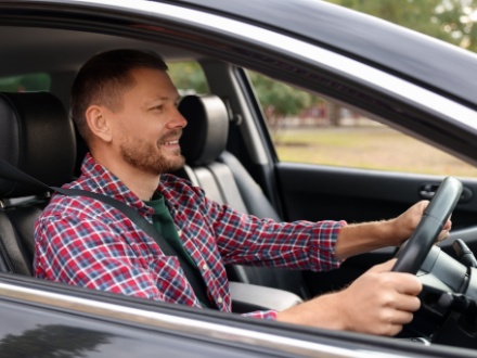man driving car