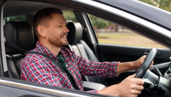 man driving car