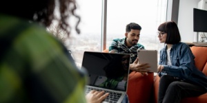 group of people in office on laptops