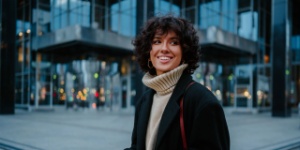 smiling woman in the city on phone