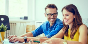 young couple calculating finances at home