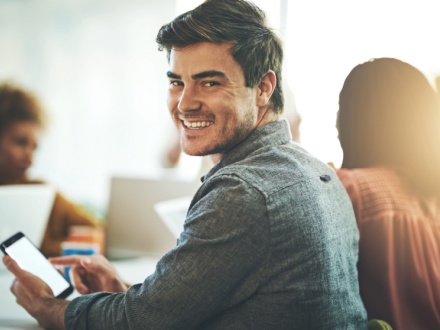 young business man in office on phone