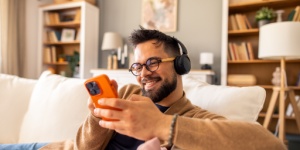 man at home listening to music