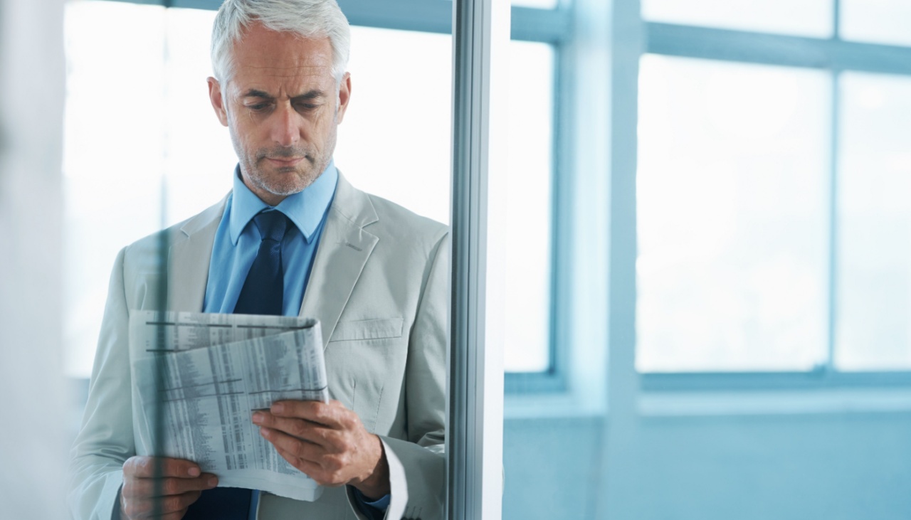 business man reading a newspaper