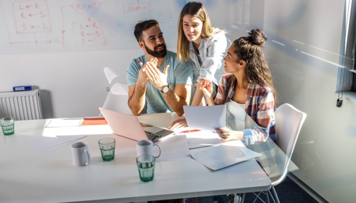 three office staff having a meeting