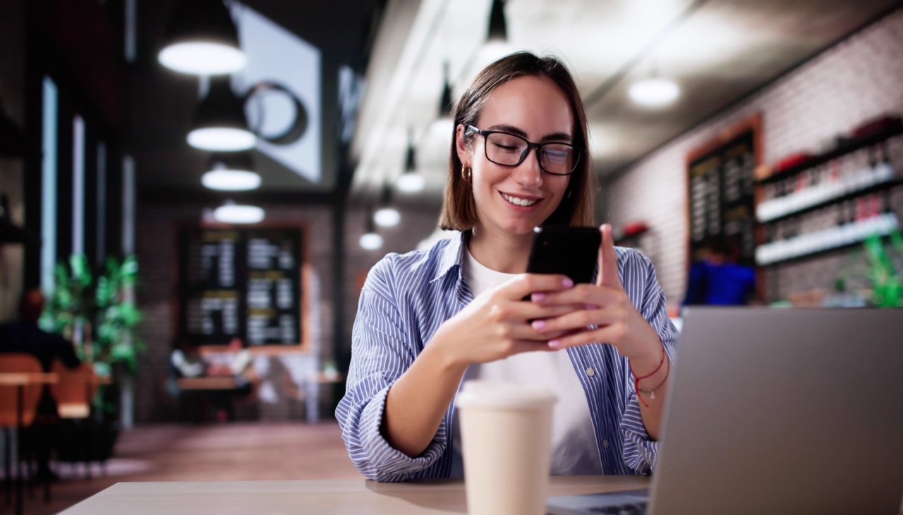 student in coffee shop on phone