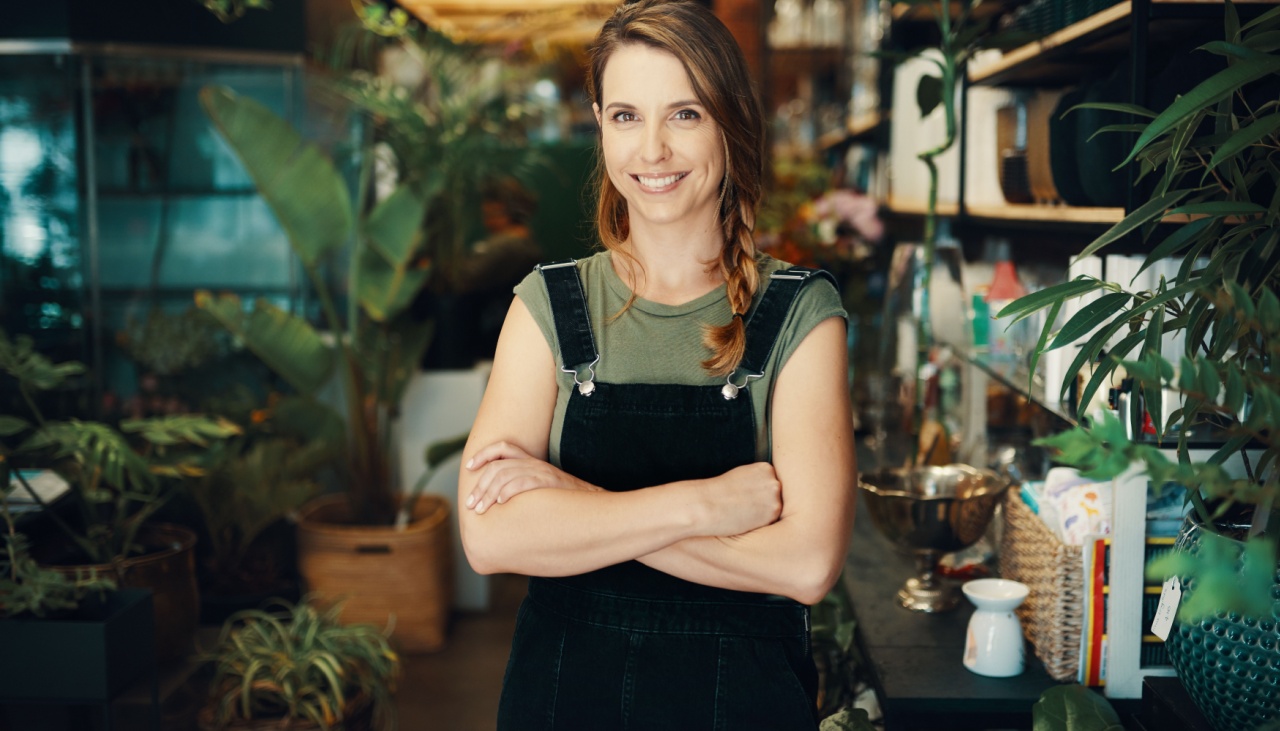 Smiling florist in her flower shop