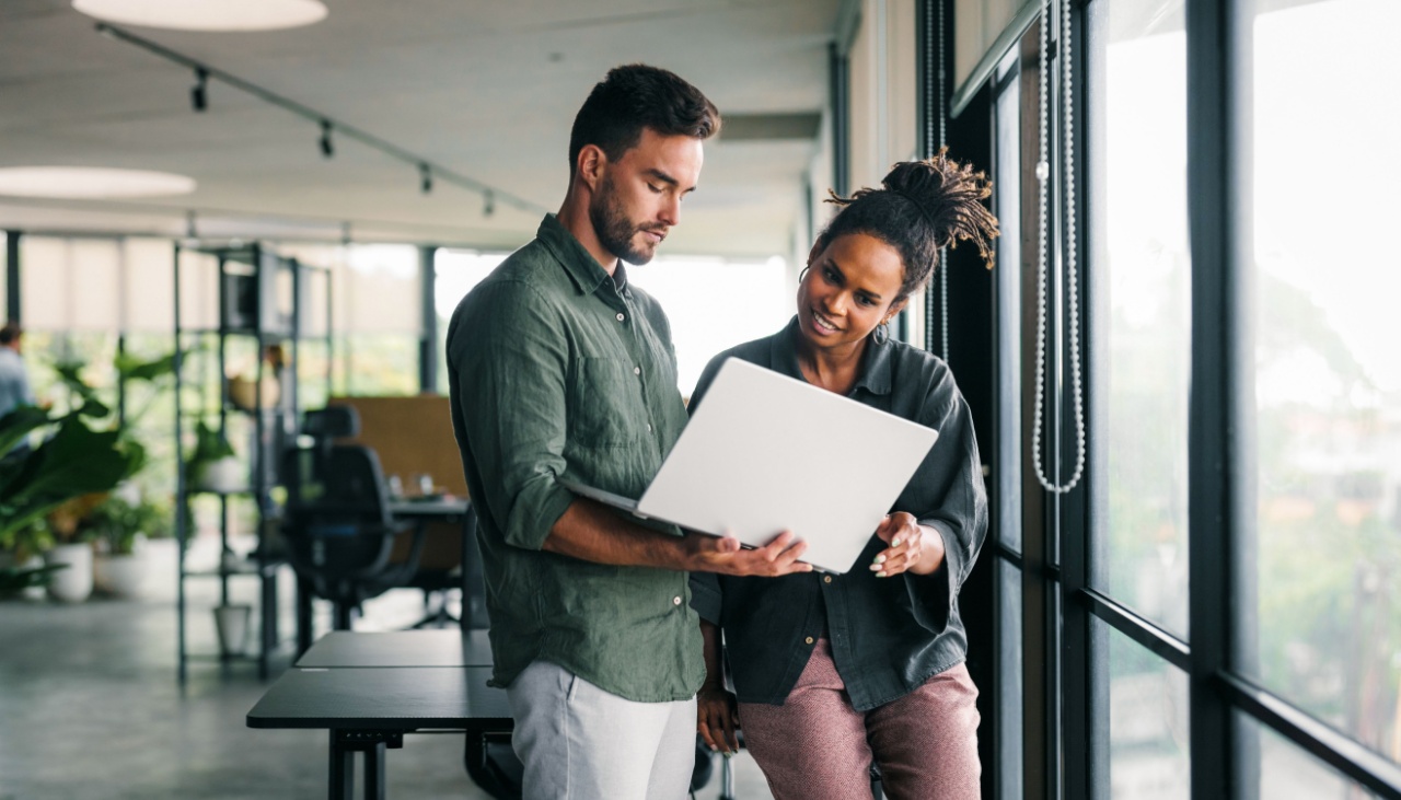 business people working together on laptop computer