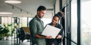 business people working together on laptop computer