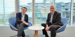 Ronan O'Neill from Broker Marketing and Denis O’Rourke Zurich financial planner sitting in office talking to each other