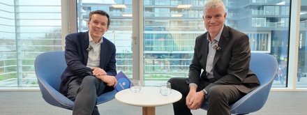 Ronan O'Neill from Broker Marketing and Denis O’Rourke Zurich financial planner sitting in office talking to each other