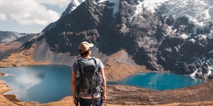 Male hiker enjoying views of mountains and lakes