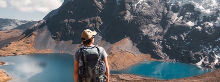 Male hiker enjoying views of mountains and lakes