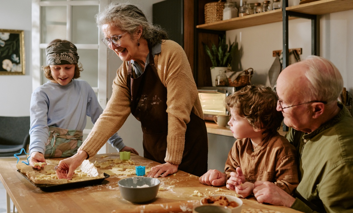 Grandparents cooking at home with grandchildren