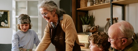 Grandparents cooking at home with grandchildren