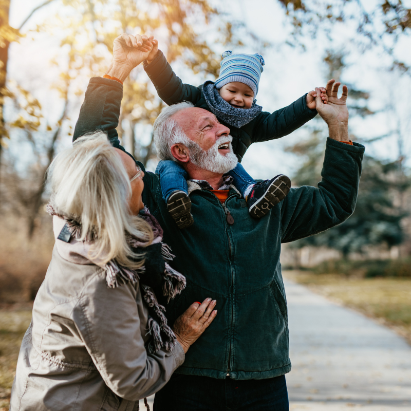 Grandparents playing with child