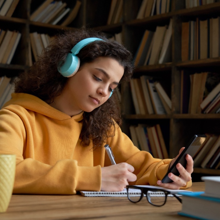 teenager girl studying in the library
