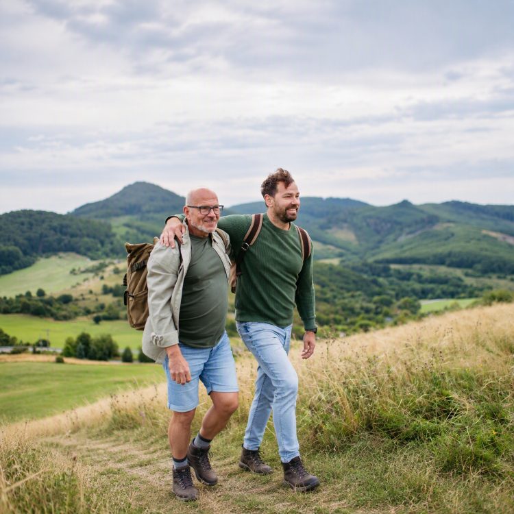 Father and adult son out waking in the countryside